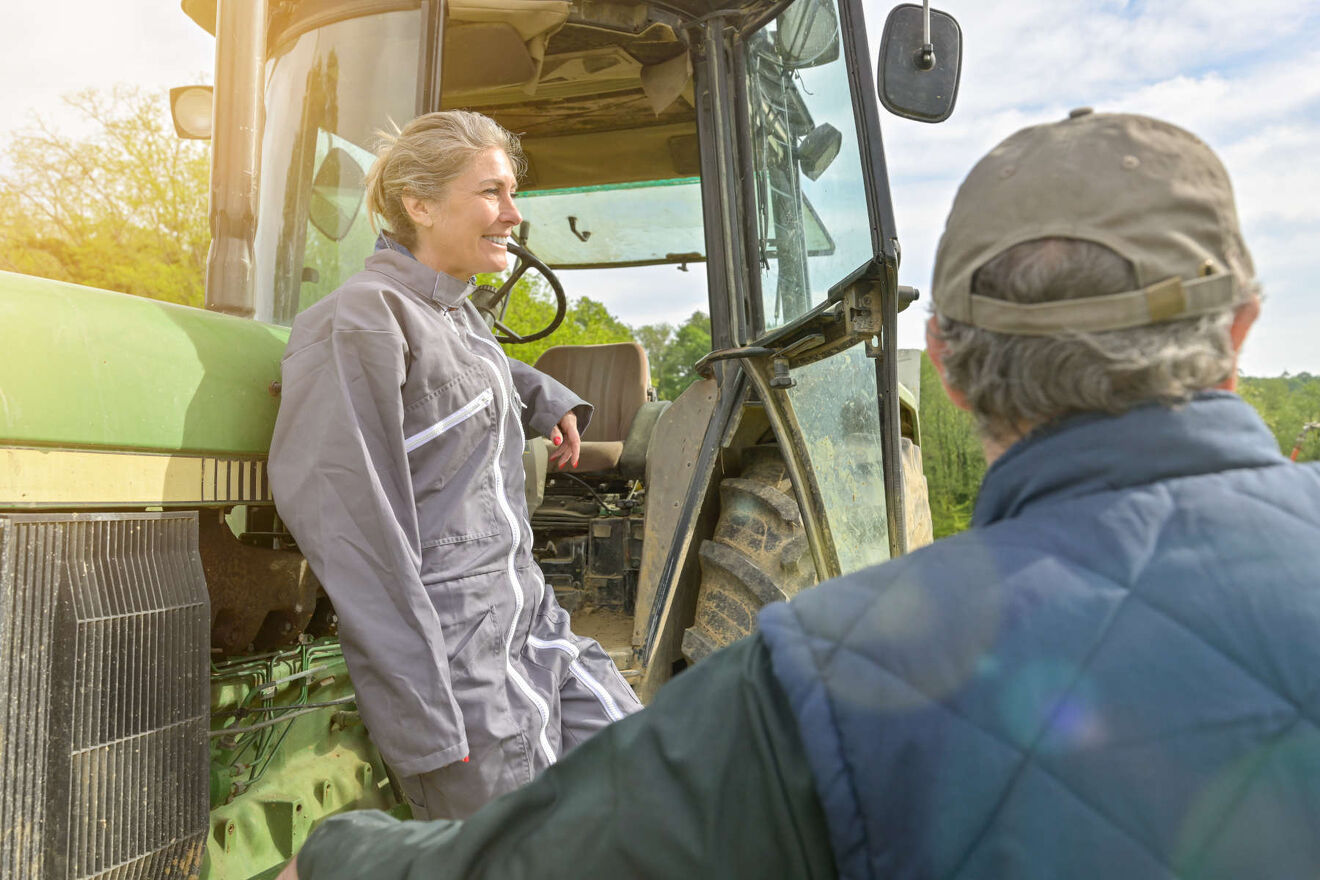 Man and woman resting on tractor